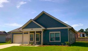 Tupelo apartment for rent - a blue house with a lawn in front of it