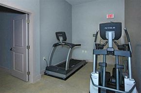 Baton Rouge apartment for rent - a gym with exercise equipment and a white door