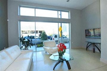 Baton Rouge apartment for rent - a living room with a white couch and a glass table