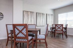 Baton Rouge apartment for rent - a dining room with a wooden table and chairs
