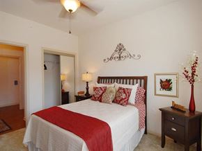 Covington apartment for rent - a bedroom with a bed and a ceiling fan