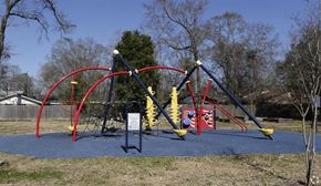 Scotlandville apartment for rent - a playground with swings and other toys in a park