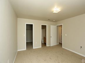Scotlandville apartment for rent - an empty living room with doors to the bathroom and a closet