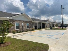 Sterlington apartment for rent - A parking lot in front of a building with a fire hydrant on the right.