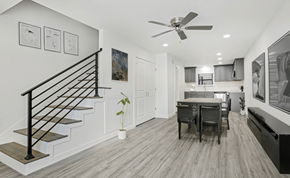 Gonzales apartment for rent - A modern interior with a staircase, a dining table, and a ceiling fan.