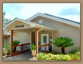 Slidell apartment for rent - A small building with a porch and a sign that says "OFFICE".