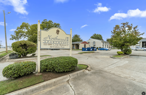 Shreveport apartment for rent - A sign for Northwood II, a 222-bedroom property, stands in front of a building.