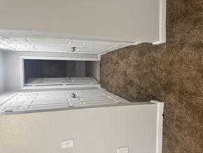 Sulphur apartment for rent - A white refrigerator with a freezer drawer and a water dispenser.