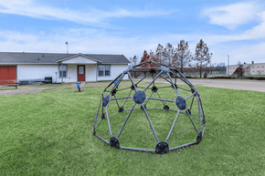 Shreveport apartment for rent - A large metal sculpture in the shape of a sphere is placed on a grassy field.