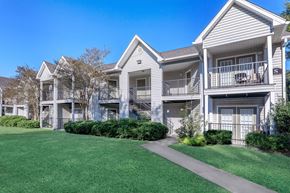 Lafayette apartment for rent - A row of townhouses with a clear blue sky above.