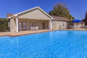 Lafayette apartment for rent - A house with a blue pool in front.