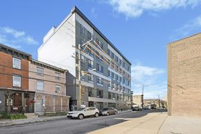 Philadelphia apartment for rent - a large apartment building on a city street at The Commons On Ludlow Apartments, Philadelphia, 19104