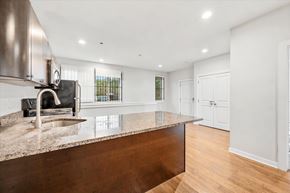 Philadelphia apartment for rent - A modern kitchen with a dark brown countertop and stainless steel appliances.