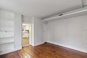 Philadelphia apartment for rent - a bedroom with hardwood floors and white walls