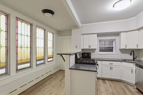 Philadelphia apartment for rent - a kitchen with a stove top oven next to a window