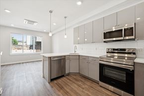 Philadelphia apartment for rent - a kitchen with stainless steel appliances and white cabinets