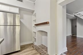 Philadelphia apartment for rent - a kitchen with a fireplace and a refrigerator