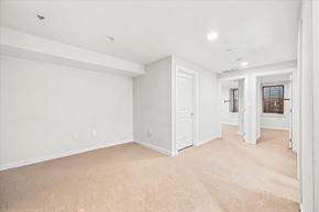 Philadelphia apartment for rent - A large empty room with carpeted floor and white walls.