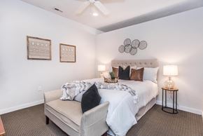 Philadelphia apartment for rent - a bedroom with a large bed and a ceiling fan