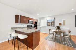 Philadelphia apartment for rent - A kitchen with a bar and chairs.