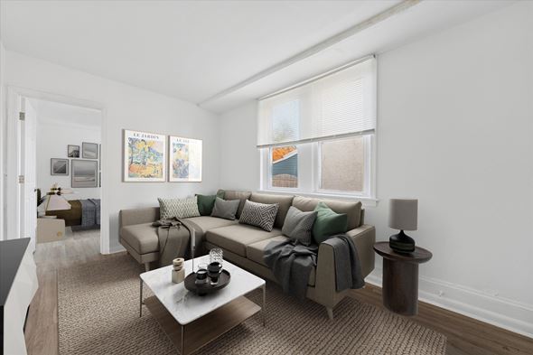 Philadelphia apartment for rent - A living room with a grey couch and a coffee table.