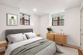 Philadelphia apartment for rent - a bedroom with a bed and two windows