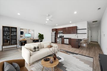 Philadelphia apartment for rent - A modern living room with a white sofa and a coffee table.