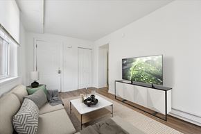Philadelphia apartment for rent - A living room with a couch, coffee table, and a television.