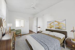 Philadelphia apartment for rent - A bedroom with a bed, a chair, and a painting on the wall.