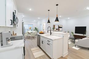 Philadelphia apartment for rent - A modern kitchen with white cabinets and a large island.