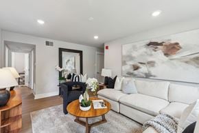 Philadelphia apartment for rent - A living room with a white couch and a coffee table.