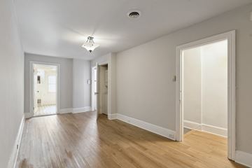 Philadelphia apartment for rent - a renovated living room with white walls and wood floors