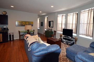 Philadelphia apartment for rent - a living room with a blue couch and a tv