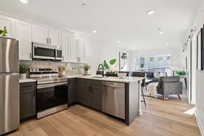 Philadelphia apartment for rent - Kitchen with stainless steel appliances and a counter top at The Isaac Apartments, Philadelphia, PA 19122