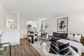 Flourtown apartment for rent - A modern living room with a grey couch and a coffee table.