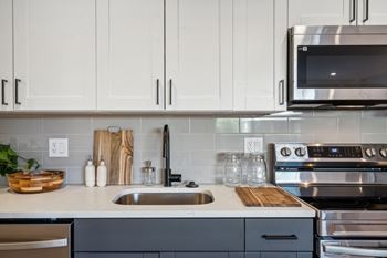 A modern kitchen with a stainless steel oven