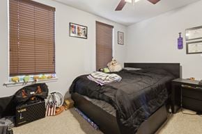 Philadelphia apartment for rent - a bedroom with a bed and a window with blinds