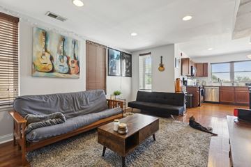 Philadelphia apartment for rent - a living room with leather couches and a coffee table