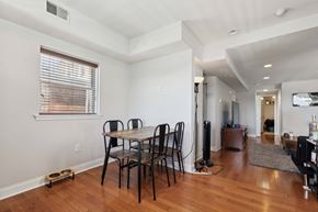 Philadelphia apartment for rent - a dining room with a wooden table and chairs