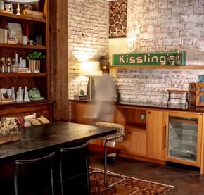 Philadelphia apartment for rent - a table and chairs in a room with a brick wall