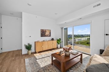 Fargo apartment for rent - A living room with a brown coffee table and a painting on the wall.