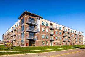 Fargo apartment for rent - A large apartment building with a sign that says "BROOKLYN".