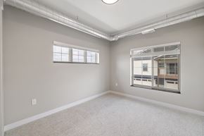 Fargo townhouse for rent - A room with a window and a view of a building outside.