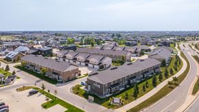 West Fargo townhouse for rent - A large residential complex with multiple buildings and a parking lot.