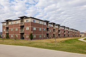 Fargo apartment for rent - Apartment building with a green lawn in front.