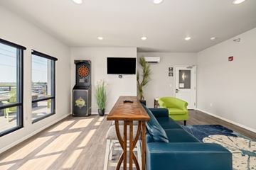 Fargo apartment for rent - A modern living room with a wooden table and blue couch.