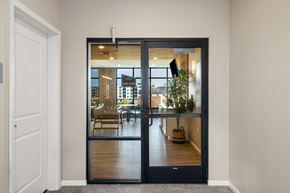 Fargo apartment for rent - A black door with a glass window leads to a dining room.