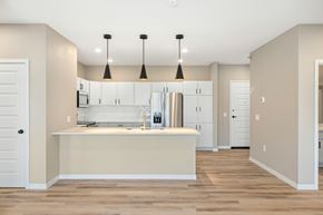 Fargo apartment for rent - A kitchen with a white counter and cabinets.