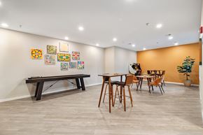 Fargo apartment for rent - a dining room with a table and chairs and a pool table