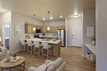Fargo apartment for rent - A modern kitchen with a dining table and chairs.